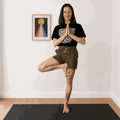 Lee demonstrating tree pose during a private yoga session